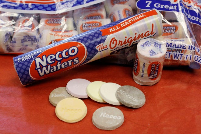 FILE - In this Oct. 14, 2009 file photo, Necco Wafers are displayed in Boston. The owner of a company that makes candies such as Necco wafers and Sweethearts has unexpectedly shut down operations at its Massachusetts plant. The Boston Globe reported Round Hill Investments LLC announced Tuesday, July 24, 2018, it is selling Necco brands to another confection manufacturer and closing down its Revere plant. (AP Photo/Charles Krupa, File)