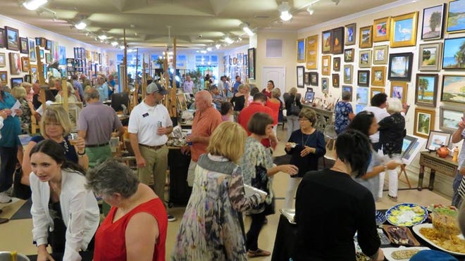 A packed house enjoys the opening reception for 'Paint the Town' at The Artist Cove studio gallery in Panama City on July 19. [CONTRIBUTED PHOTO]