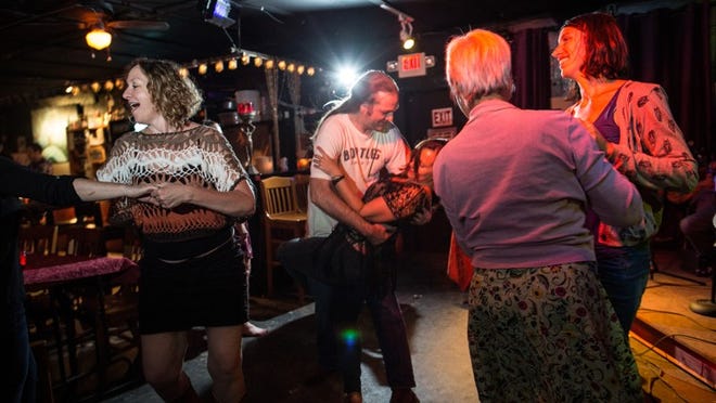 Patrons take over the dance floor as the Texas East Side Kings play the blues at Skylark Lounge on Saturday, July 19, 2014.