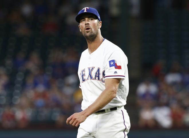 Texas Rangers starting pitcher Cole Hamels reacts after giving up a two-run home run to Oakland Athletics' Stephen Piscotty during the fifth inning of a baseball game Monday, July 23, 2018, in Arlington, Texas. (AP Photo/Mike Stone)
