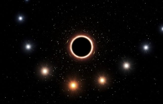 This artist's impression provided by the European Southern Observatory in July 2018 shows the path of the star S2 as it passes close to the supermassive black hole at the center of the Milky Way galaxy. As the star gets nearer to the black hole, a very strong gravitational field causes the color of the star to shift slightly to the red, an effect of Einstein's general theory of relativity. European researchers reported the results of their observations in the journal Astronomy & Astrophysics on Thursday, July 26, 2018. (M. Kornmesser/ESO via AP)