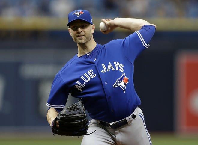 In this June 13, 2018, file photo, Toronto Blue Jays' J.A. Happ pitches to the Tampa Bay Rays during the first inning of a baseball game in St. Petersburg, Fla. The New York Yankees acquired Happ from Toronto to bolster their starting rotation. The Yankees sent infielder Brandon Drury and minor league outfielder Bill McKinney to the Blue Jays. [CHRIS O’MEARA/ASSOCIATED PRESS]