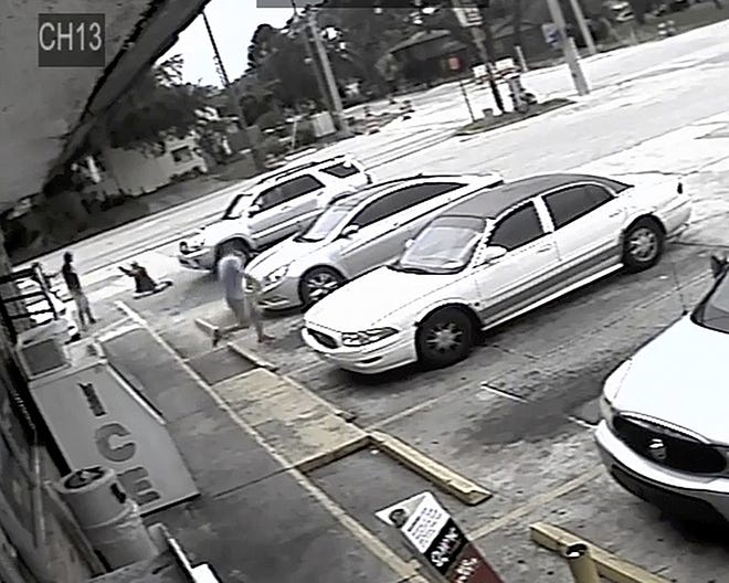 Markeis McGlockton, far left, is shown in July 19 video surveillance in an altercation with Michael Drejka in the parking lot of a convenience store in Clearwater. The family of McGlockton wants charges to be filed against Drejka, a white man who shot and killed the black father of three. [Pinellas County Sheriff's Office via AP]