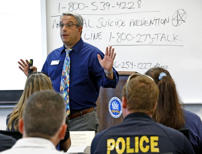 Stewart-Marchman-Act Behavioral Healthcare senior director of crisis services Tore Gintoli teaches a suicide prevention class to law enforcement on June 8. The organization recently received a five-year, $2 million grant to care for clients at risk of suicide. [News-Journal File]