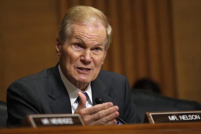 Democrat Bill Nelson went to Panhandle beaches Friday to condemn his U.S. Senate rival, Gov. Rick Scott, for the law that started a clash over beach access. [AP Photo/Jacquelyn Martin]