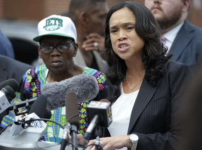 Baltimore State's Attorney Marilyn Mosby holds a news conference near the site where Freddie Gray was arrested after her office dropped the remaining charges against three Baltimore police officers awaiting trial in Gray's death, on July 27, 2016, in Baltimore. The decision by prosecutors comes after a judge had already acquitted three of the six officers charged in the case. [Steve Ruark/The Associated Press]
