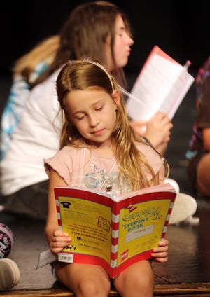 Presley Ware reads lines for the Kathie Burgin Children’s Theatre Workshop production of 'Seussical, Jr.' on July 20. [Brittany Randolph/The Star]
