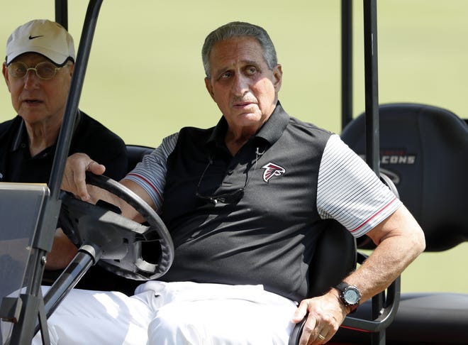 Atlanta Falcons owner Arthur Blank watches training camp practice Friday in Flowery Branch. Blank believes players should have the right to speak out on important issues even though he is not expecting national anthem protests from his players this season. [DAVID GOLDMAN/THE ASSOCIATED PRESS]