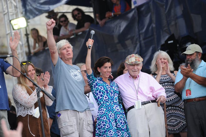 Gov. Gina Raimondo stands with George Wein to announce that the state of Rhode Island has renewed its lease agreement to keep the Newport festivals in Newport. [PHOTO BY PAUL J. SPETRINI PHOTOGRAPHY]