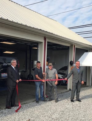Submitted photo 



President and Chief Executive Officer of the Tuscarawas County Chamber of Commerce, Scott Robinson (left), stands next to Wes Gilland and Mike Gilland as they cut the ribbon at Gilland Body Shop in New Philadelphia. Mike Mason, Vice President of the Tuscarawas County Chamber of Commerce, is at the right.