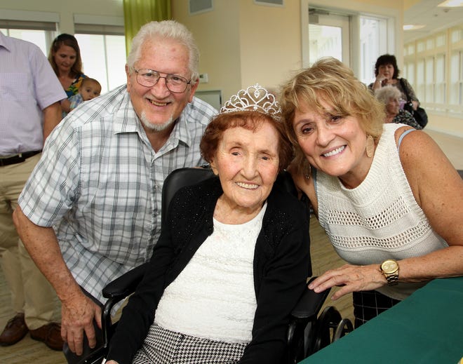 Celebrating he 109th birthday with family, Florence Shulenburg is all smiles at her party held at Dwyer Home at Fairing Way at Union Point in Weymouth, Saturday, Oct. 7, 2017. Her son, Mark Shulenburg, of Greenfield, is at left and daughter, Patricia Devin, of Quincy, on right. 

Gary Higgins/The Patriot Ledger