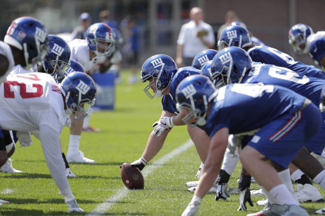 New York Giants players line up during NFL football training camp on Thursday in East Rutherford, N.J. [AP PHOTO/JULIO CORTEZ]