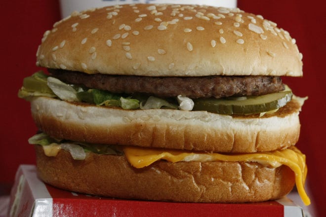 FILE - This Dec. 29, 2009 file photo shows a Big Mac hamburger at a McDonald's restaurant in North Huntingdon, Pa. The fast food restaurant is celebrating the sandwich's 50th anniversary in 2018. (AP Photo/Keith Srakocic)