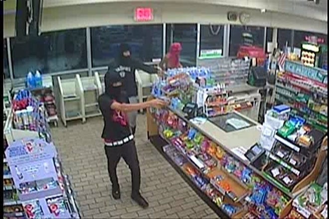 Edgewater Park police released this surveillance video image of two men who robbed the 7-Eleven store on Coooper Street on Thursday. Similar holdups happened Friday and Sunday at 7-Eleven stores in Burlington Township and Delran. [COURTESY OF EDGEWATER PARK POLICE DEPARTMENT]