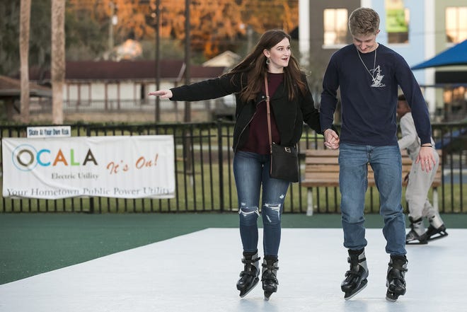 Destinee Estes and Taylor Drawdy try ice skating in Ocala on Dec. 12, 2017. Eustis is looking to have an ice skating rink during the holidays this year. [Doug Engle/Gatehouse Media]