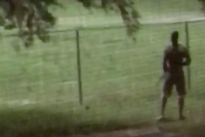 This image from cellphone video provided by the University of Florida Police Department shows a Gator football player with a fake gun at Flavet Field on May 28.
