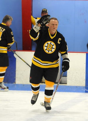 Rick Middleton is introduced. Governor Charlie Baker joined Boston Marathon bombing heroe Dic Donahue and Congressman Stephen Lynch in dropping the puck at the Hug Foundation’s charity hockey game against Boston Bruins’ legends on Saturday, Jan. 24, at 3 p.m. in Rockland.The Bruins’ lineup includes Ray Bourque, Terry O'Reilly, Bob Beers, Andy Brickley, Frank Simonetti, Rick Middleton, Reggie Lemelin, Billy O'Dwyer, Dan LaCouture, Bob Sweeney, Tom Songin, Bruce Shoebottom, Kenny Hodge, Fred Ahern and Jay Miller. They will play against the “Ice Huggers,” a team made up of local skaters of varying ages.Also present will be Joe Ligotti “The Guy from Boston” radio personality; Former Heavyweight Champ Hurricane Peter McNeeley, and Sports Guy Chris Collins. The players and “celebrities” will sign autographs between periods.Taking place at the Rockland Ice Rink at 599 Summer Street in Rockland, the family-oriented event will include raffles and guaranteed laughs. Admission is $10/person.The HUG Foundation (Help Us Give) is a 501C-3 non-profit founded by Alex and Lisa Bezanson of Abington in memory of Alex’ sister Linda Harmon. The Foundation assists individuals, families and groups whose lives have been touched by illness, accident or financial hardship. (Marc Vasconcellos/The Enterprise)