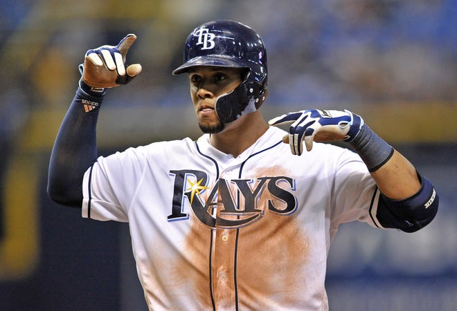 Tampa Bay's Carlos Gomez gestures toward the Rays dugout after hitting a two-run single off Los Angeles Angels reliever Noe Ramirez during the fourth inning of their game Tuesday night. [STEVE NESIUS/THE ASSOCIATED PRESS]