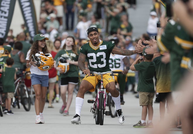 Green Bay Packers' Jaire Alexander rides a bike to NFL football training camp Thursday, July 26, 2018, in Green Bay, Wis. [MORRY GASH/THE ASSOCIATED PRESS]