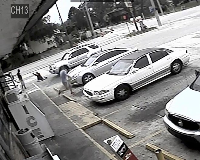 FILE - In this July 19, 2018 file frame from surveillance video released by the Pinellas County Sheriff's Office, Markeis McGlockton, far left, is shot by Michael Drejka during an altercation in the parking lot of a convenience store in Clearwater, Fla. A Florida sheriff said the case is still under investigation and will be sent to the state attorney. Pinellas County Sheriff Bob Gualtieri acknowledged during a Tuesday, July 31, news conference that the shooting death of McGlockton has grabbed national attention and intensified the debate about Florida's "stand your ground" law. (Pinellas County Sheriff's Office via AP, File)