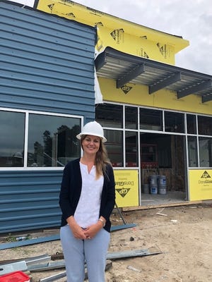Melissa Crosby, head of school and executive director of Polaris Tech, stands in front of the new building being completed for the upcoming school year. [Shellie Murdaugh/Bluffton Today]