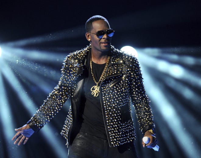R. Kelly performs at the 2013 BET Awards in Los Angeles. Kelly sings about his troubles and battles in a new 19-minute song, addressing sexual abuse claims against him that remerged and put a screeching halt on his career. [Photo by Frank Micelotta/Invision/AP, File]