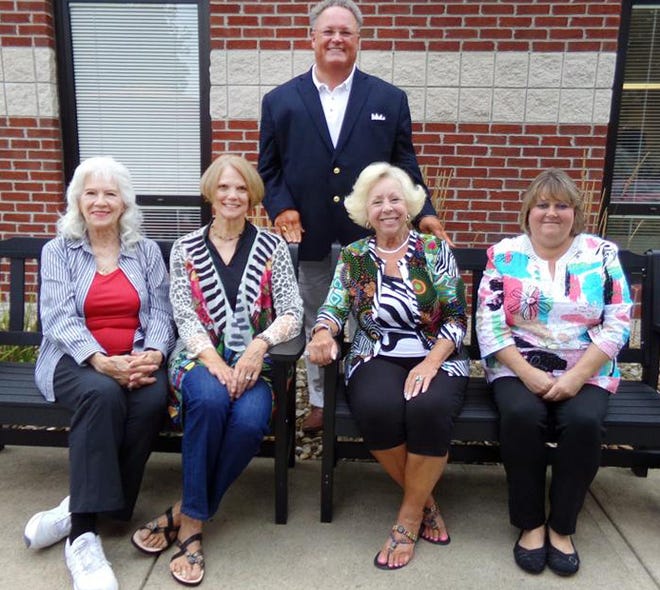 The Grow & Show Garden Club, Pat Graven, and Ohio Association of Garden Clubs recently donated two benches to the Guernsey County Senior Citizens Center, Inc., adding to the Senior Center’s lovely outdoor space created for senior citizens to relax and enjoy. One bench was donated by Grow & Show Garden Club and Region 8 Ohio Association of Garden Clubs. The second bench was donated by Pat Graven in memory of her late husband, Tom Graven. Front, l to r, Grow & Show Garden Club members Pat Graven, Kathleen Bennett, Club President; Bonnie Perkins, Region 8 Director of Ohio Association of Garden Clubs; Janie Downerd, Senior Center Activities Coordinator. Behind them is Shon Gress, executive director and CEO of Guernsey County Senior Citizens Center, Inc. and Meals on Wheels, Guernsey County. To learn more about the Senior Center, call (740) 439-6681 or visit www.GuernseySenior.org.