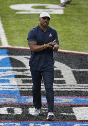 NFL Hall of Fame inductee Brian Dawkins is introduced before the Hall of Fame game between the Baltimore Ravens and the Chicago Bears Thursday night in Canton, Ohio. [AP Photo/Ron Schwane]