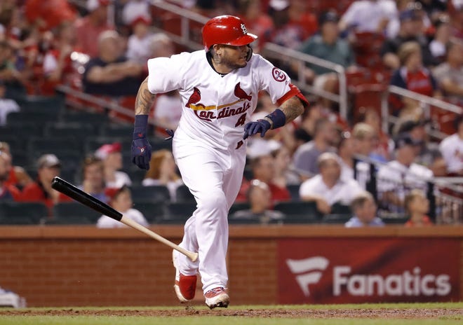 St. Louis Cardinals' Yadier Molina watches his two-run double during the eighth inning of the team's baseball game against the Colorado Rockies on Wednesday in St. Louis. (AP Photo/Jeff Roberson)