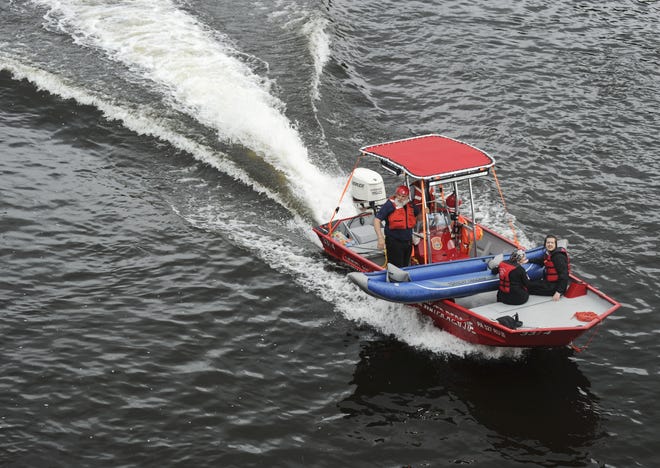 A water rescue team from Portland Hook and Ladder takes to the Delwaware River during the search for a missing boater near Portland on Thursday, August 2, 2018.[KEITH R. STEVENSON/POCONO RECORD]