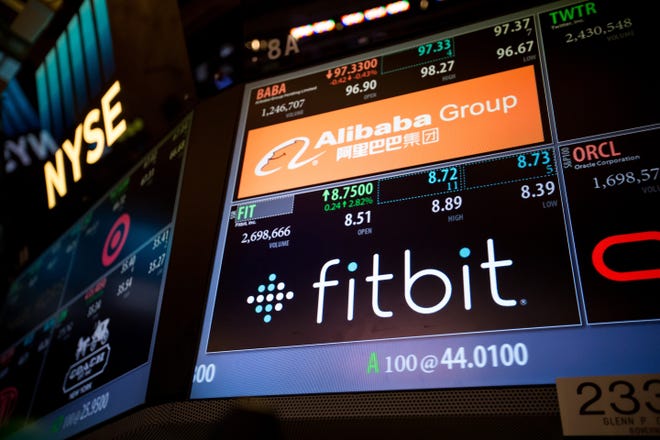 Fitbit signage is displayed on the floor of the New York Stock Exchange (NYSE) in New York on Nov. 4, 2016. MUST CREDIT: Bloomberg photo by Michael Nagle