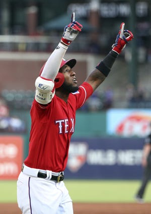 Texas Rangers' Jurickson Profar raises his arms as he approaches home plate on his three-run home run during the first inning of the team's baseball game against the Baltimore Orioles on Thursday in Arlington. [AP Photo/Richard W. Rodriguez]