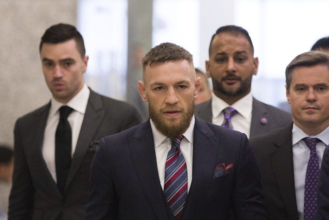 FILE - In this July 26, 2018, file photo, mixed martial arts fighters Conor McGregor leaves the courthouse following a hearing in New York. McGregor will return to mixed martial arts on Oct. 6 in Las Vegas with a bout against UFC lightweight champion Khabib Nurmagomedov. (AP Photo/Kevin Hagen, File)