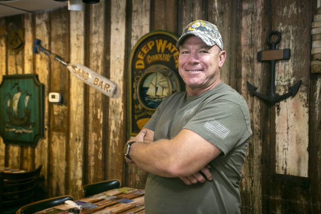 Glen Key is a vetersn of the Marine Corp and the owner of Quaterdeck in Umatilla. "Coach Comer told me that I was one of his very few quarterbacks allowed to call his own plays. That was special." [Cindy Sharp/Correspondent]