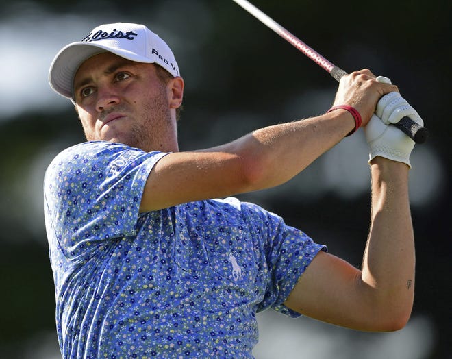 Justin Thomas watches his tee shot on the 17th hole during the third round of the Bridgestone Invitational golf tournament at Firestone Country Club on Saturday in Akron, Ohio. [AP Photo/David Dermer]