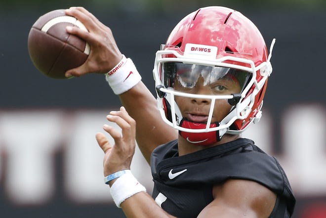Georgia quarterback Justin Fields throws a pass during a team practice in Athens. [Joshua L. Jones/Athens Banner-Herald]