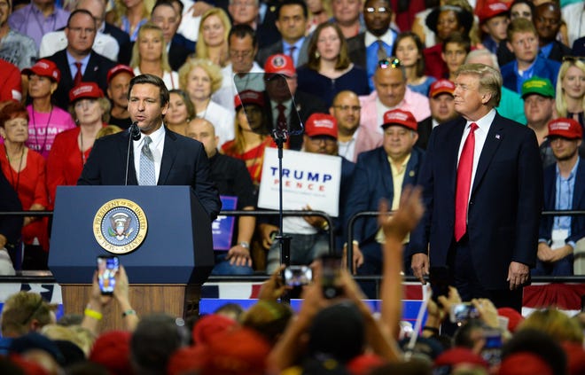 Ron DeSantis, Republican candidate for Florida governor, speaks at a rally with President Donald Trump in Tampa on Tuesday. Trump's support has brought in waves of campaign cash for DeSantis from national donors. [Dan Wagner/Gatehouse Media]