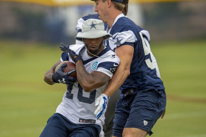 Dallas Cowboys running back Tavon Austin, left, runs by teammate linebacker Sean Lee during training camp last week in Oxnard, Calif. [AP Photo/Gus Ruelas, File]