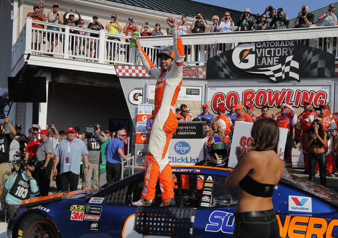 Chase Elliott, center, celebrates after winning a NASCAR Cup Series auto race Sunday in Watkins Glen, N.Y. [AP Photo/Julie Jacobson]