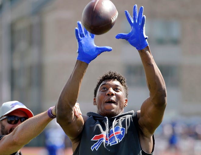 FILE - In this July 27, 2018, file photo, Buffalo Bills wide receiver Zay Jones catches a pass after practice at the NFL football team's training camp in Pittsford, N.Y. The Bills have activated Jones off the non-football injury list, putting the second-year player in position to practice for the first time this offseason. (AP Photo/Adrian Kraus, File)