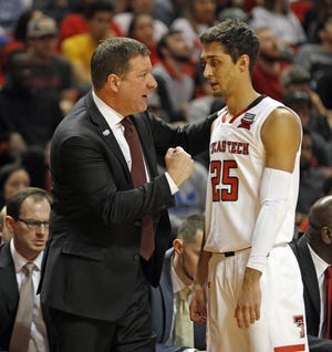 Texas Tech coach Chris Beard talks to Davide Moretti (25) during the first half of an Big 12 Conference game against Oklahoma State back on Jan. 23 inside United Supermarkets Arena. Moretti is one of several players returning to the Red Raiders lineup in the fall. [AP Photo/Brad Tollefson]