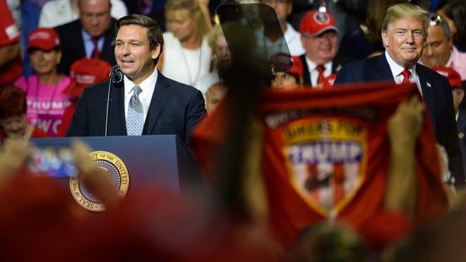 Governor candidate Ron DeSantis, left, and President Donald Trump in Tampa on July 31, 2018.