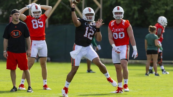 University of Miami quarterback Malik Rosier (12) throws a ball during the first day of fall training camp at the Greentree Practice Fields in Coral Gables on Saturday, August 4, 2018.
