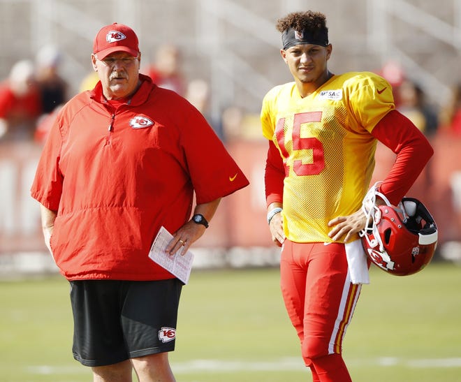Kansas City Chiefs quarterback Patrick Mahomes, right, and coach Andy Reid watch a drill during training camp Thursday in St. Joseph, Mo. [Charlie Riedel/The Associated Press]