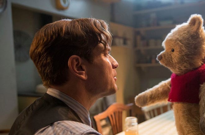 FILE - This image released by Disney shows Ewan McGregor in a scene from "Christopher Robin." Tom Cruise has outrun Winnie-the-Pooh at the box office. â€œMission: Impossible -- Falloutâ€ topped ticket sales for the second straight weekend with an estimated $35 million despite newcomer â€œChristopher Robin.â€ According to studio estimates Sunday, Aug. 5, 2018, the sixth â€œMission: Impossibleâ€ installment has amassed $124 million in its first 10 days of release. (Laurie Sparham/Disney via AP, File)