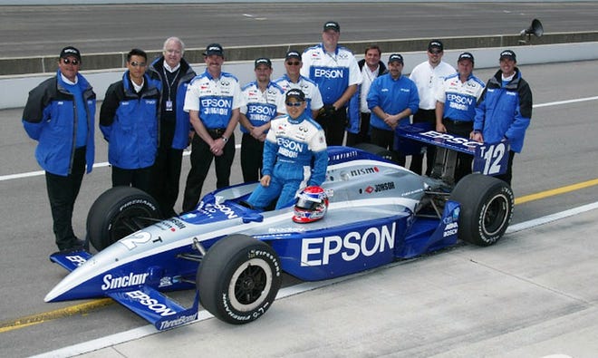 Shigeaki Hattori and crew pose following their 2002 Indy 500 successful qualifying run of 228.192, good for 27th starting position. Hattori finished 20th in his rookie run, completing 197 of 200 laps when he encountered mechanical woes. [Indianapolis Speedway]