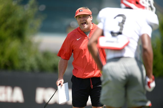 Georgia coach Kirby Smart hollers instructions to the Bulldogs during Monday's practice. The temperature was in the 90s as practice began. (Photo by UGA Sports Communications)