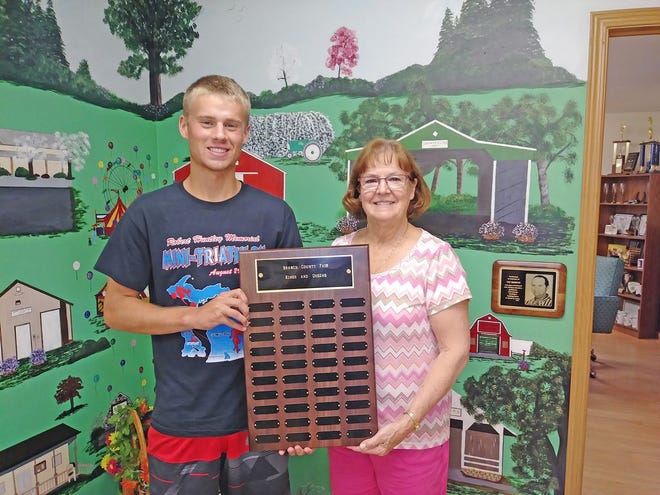 Culy's Jewelry is proud to donate the new 'Branch County Fair Kings and Queens' plaque. Every year Culy's donates the engraving for the specialty plaques throughout the fair. Kathy Culy is shown presenting the plaque to the 2017 Fair King, Zack Murphy.