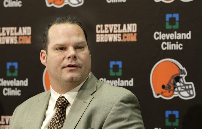 In this Jan. 14, 2011 photo, Cleveland Browns GM Tom Heckert speaks at a news conference in Berea, Ohio. Heckert died Sunday night at the age of 51 following a long illness. [AP PHOTO/AMY SANCETTA]