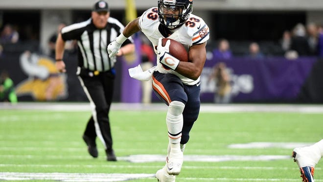 Jeremy Langford, former Chicago Bears running back, carries the ballin Minneapolis, Minnesota. (Photo by Hannah Foslien/Getty Images)
